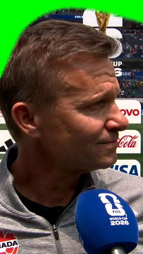 Jessie Marsch states into space as he gets emotional in a post-match interview