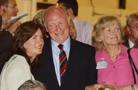 Alamy Neil Kinnock (centre) with Eluned Morgan (left) and his wife Glenys Kinnock (right) as they wait for the declaration at Haverfordwest