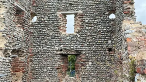 Andrew Turner/BBC North-west corner tower of Baconsthorpe Castle with a decayed oak lintel and three openings replaced by concrete lintels