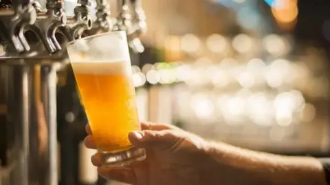 Picture shows a pint being poured at a pub 