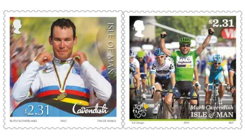 IOMPO Mark Cavendish wearing the gold medal and Rainbow Jersey of World Road Race Champion, and crossing the fishing line wearing green with his arms in the air with clenched fists in celebration as he crosses the finishing line. 