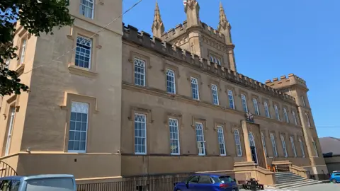 BBC Elizabeth College - a sandstone building that looks like a castle