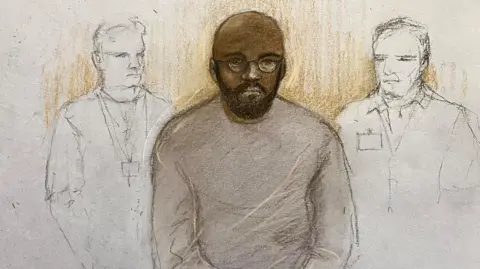 PA Media A courtroom sketch of Juan Joseph, wearing glasses and a long sleeve top