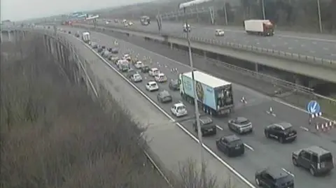 Traffic seen queuing on the M6 northbound on a motorway traffic camera.