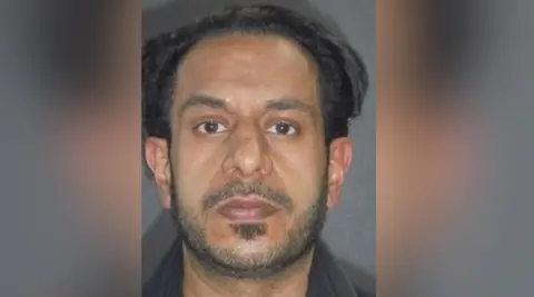 West Yorkshire Police  A police mugshot of Yasar Hussain, a man with black hair, a receding hairline, dark eyes and short stubble