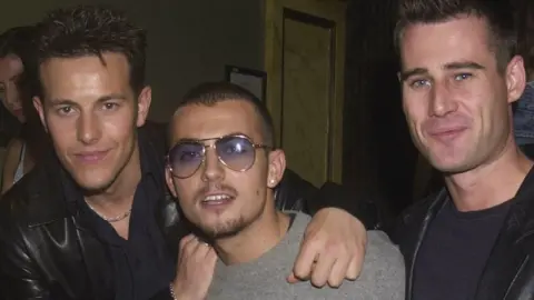 Getty Images Steps's Lee Latchford-Evans, Paul Danan and actor and presenter Tim Vincent at a fashion show after-party in 2001