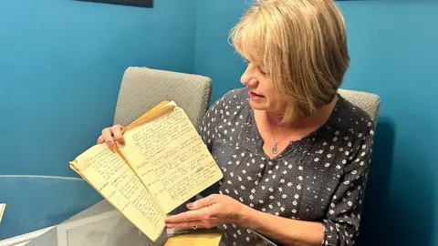 Julie Jones with her grandfather's war diary