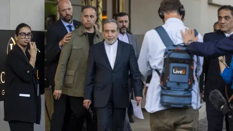 EPA-EFE/Shutterstock Iranian Foreign Minister Abbas Araghchi talking to the media in front of the Intercontinental Hotel, after a meeting of foreign ministers of German