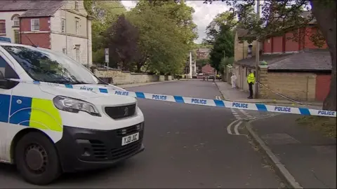 BBC/Rob Smith A police cordon at Francis Street, Chapeltown