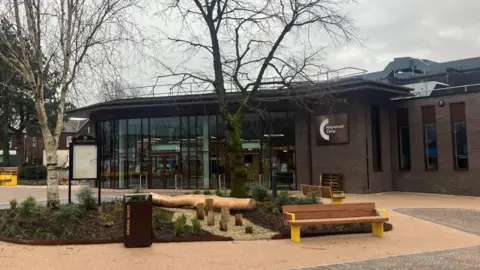 Photograph of the newly refurbished Heywood Civic. The image shows the glass-fronted extension and the newly refurbished Peine Square.