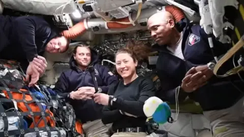 (From left) Jeremy Hansen, Reid Wiseman, Christina Koch and Victor Glover conduct a live broadcast from space