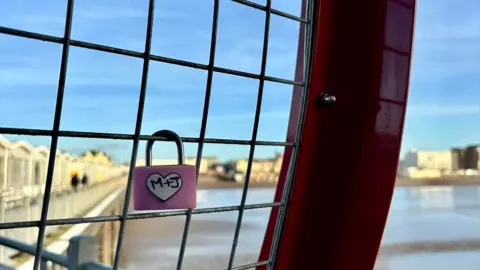 The Grand Pier A love lock on a fence on The Grand Pier