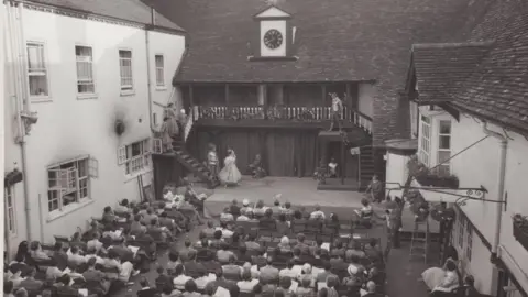 SaGT Black and white image of audience watching play