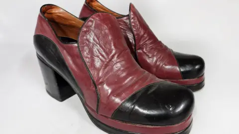 John Rolfe Auctions A pair of leather platform boots in red and black