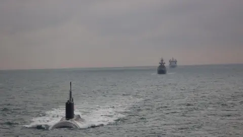 MOD The Russian Kilo-class submarine Krasnodar being tracked by RFA tanker Tidesurge