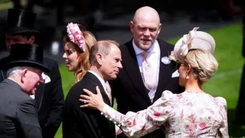 PA Media Zara Tindall and husband Mike speak with the Duke of Edinburgh at Royal Ascot