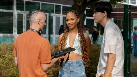 Netflix Andy speaking to two actors on set