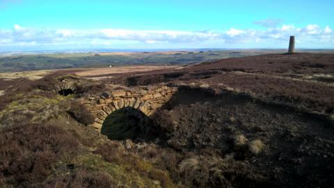 A disused mine in a large empty landscape
