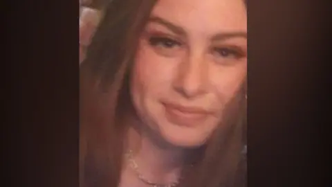 Donna Harper a grainy photograph of a girl with long hair smiling