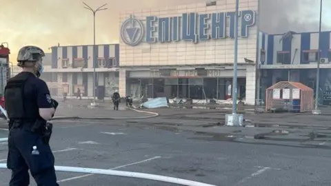 Handout A Russian air strike has hit a busy superstore in Kharkiv, killing at least two people and injuring many others