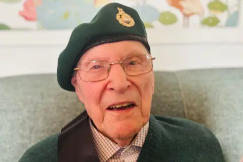 BBC Army veteran Sandy Calder wearing a green army beret and looking at the camera.