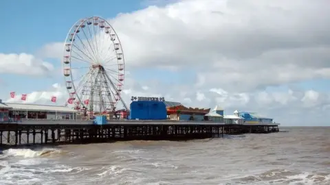 Blackpool's Central Pier, which features a big wheel and several other rides.