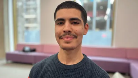 Nicola Haseler/BBC Zoubair smiling