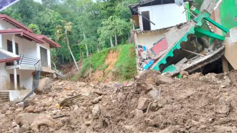 Tharnga Sanjeewa A picture showing damage from a landslide.