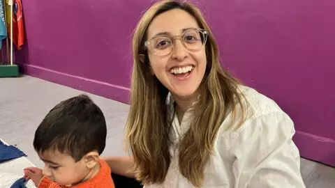 Michelle Gill, 35, with baby Ori at a sensory class.