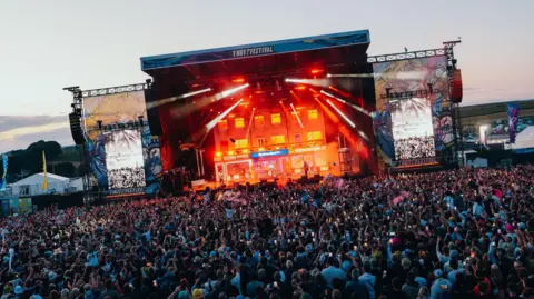 A crowd of thousands of people watch The Reytons perform at Y Not Festival 2026