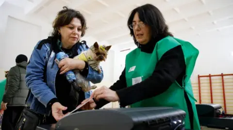 EPA-EFE/REX/Shutterstock Voter in Tbilisi