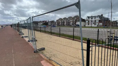 Andrew Turner/BBC Fenced-off vacant plots for beach huts in Great Yarmouth