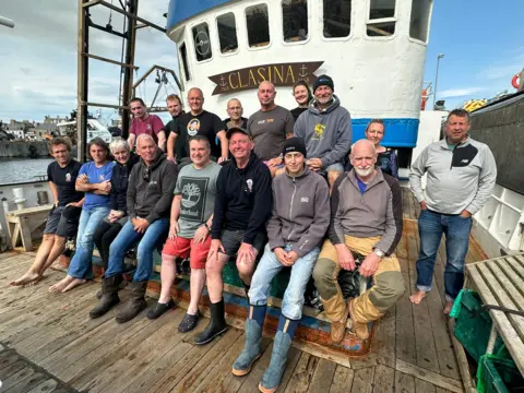 The crew of the vessel Clasina on board the boat