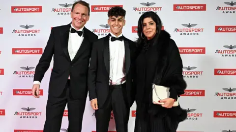 Getty Images Arvid Lindblad pictured with his dad, Stefan, and his mum Anita, at the Autosport Awards in 2023

Stefan, is Swedish. His mother, Anita, is of Indian descent. 
