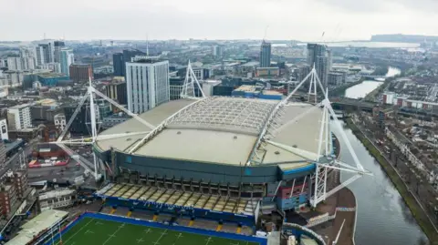Getty Images Aerial shot of the Principality Stadium in Cardiff. Cardiff Arms Park training field can be seen just infront of the stadium, while the River Taff runs along the right hand side. Several high rise apartment blocks can be seen in the background.