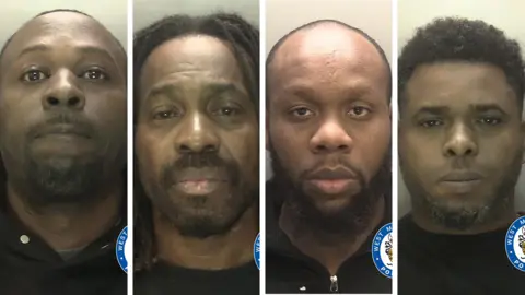 Mugshots of four men with dark hair and dark t-shirts in a row