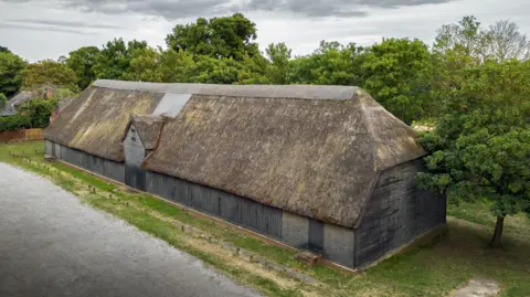 Historic England Archive  The 15th century Tithe Barn pre-restoration.