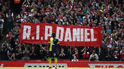 Arsenal fans held up a banner in tribute to Daniel Anjorin against Bournemouth 