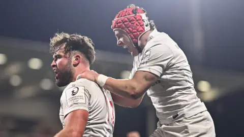 Ben Carson and Mike Lowry celebrate for Ulster