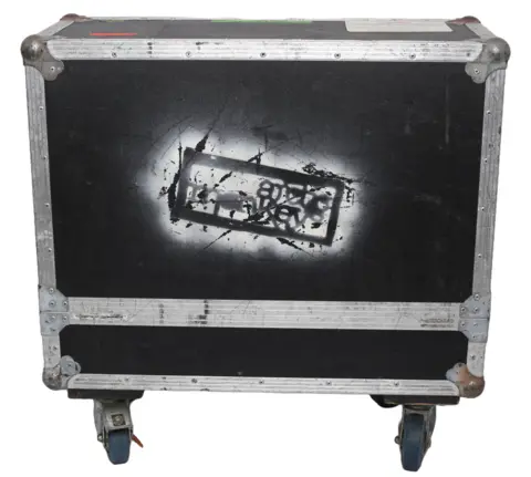 Brilliant Auctions A flight case with the Arctic Monkeys logo sprayed on. It is one of the items in the auction