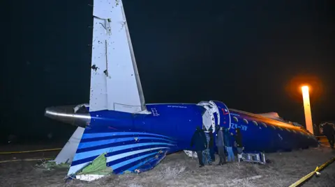 EPA The crashed plane at night in the dark