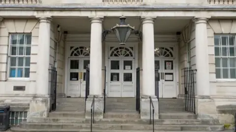 BBC The front doors of Lewes Crown Court.