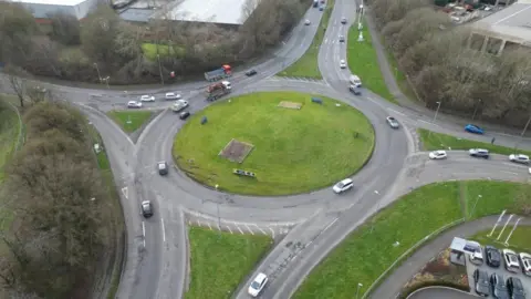 Swindon Borough Council An aerial photo of a roundabout connecting four roads, with a grassy bank in the middle.