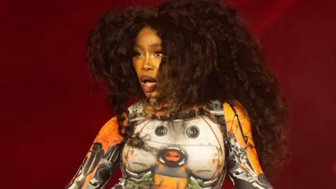 Getty Images SZA on stage at Glastonbury 2024