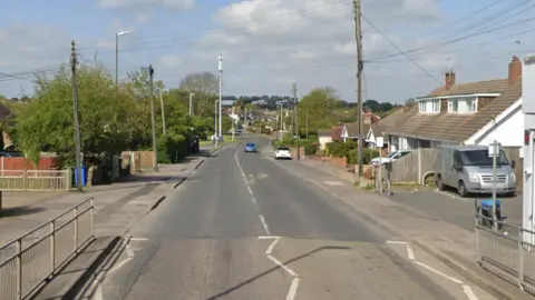 A Google Street image of a quiet road with homes either side.