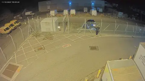 Guernsey Ports A man matching Russell Payne's description on the fence of the airport. 
