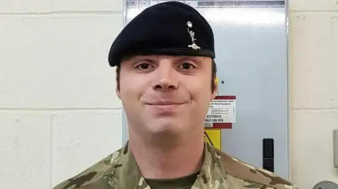 FAMILY HANDOUT L/Cpl Mongan wearing his army uniform with a black hat