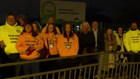 Protesters outside the school