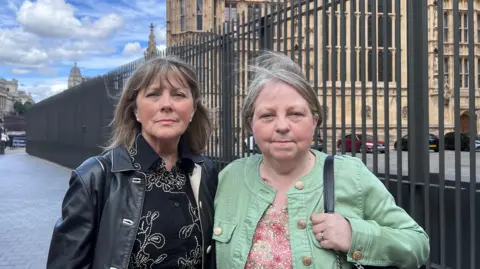 Sandra and Caroline outside the Houses of Parliament 