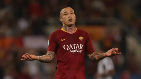 Getty Images Nainggolan plays for Roma, extending his arms in protest